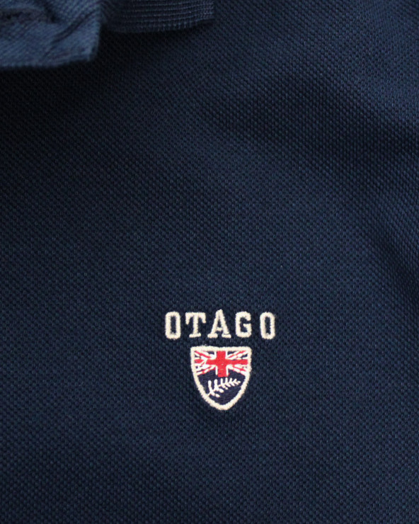 Broderie côté coeur du polo Buenago Otago bleu marine pour homme