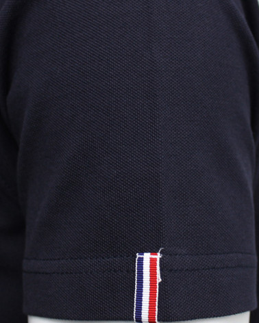 Vignette tissée sur la manche gauche du polo Montlery Otago bleu marine pour homme
