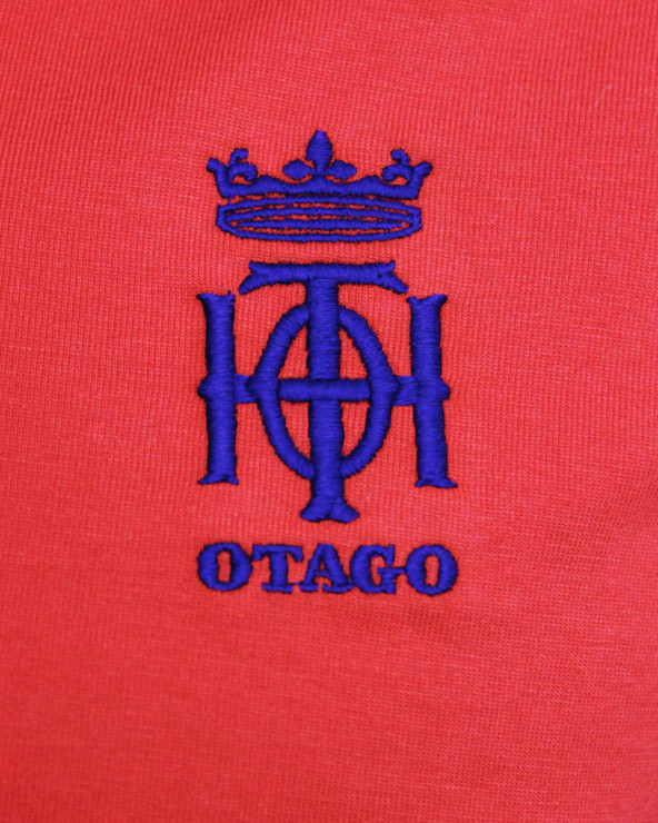Broderie côté coeur du polo Oth Otago rouge pour homme