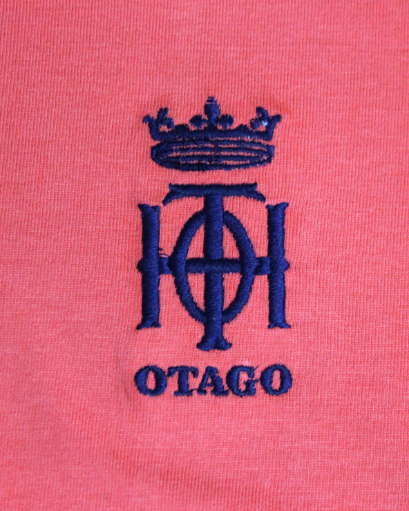 Broderie côté coeur du polo Oth Otago corail pour homme