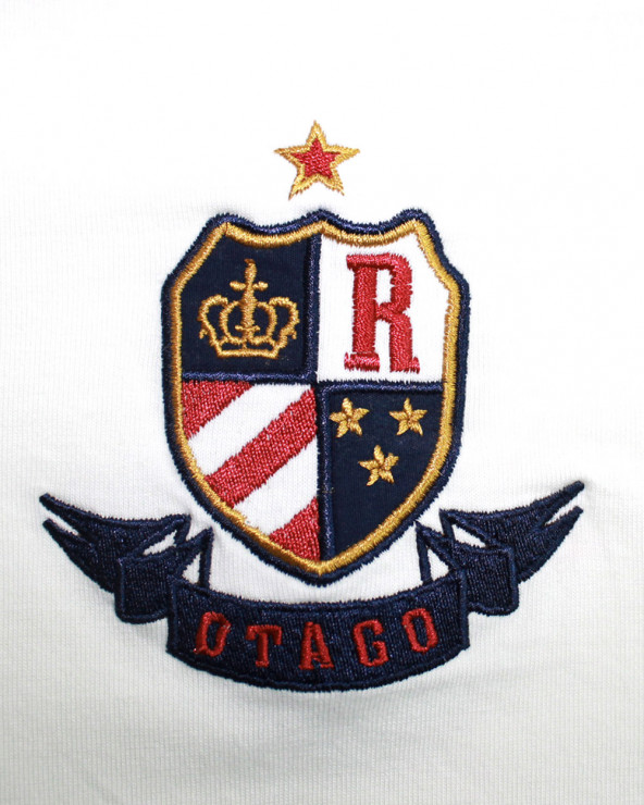 Broderie coté coeur du polo Oscar Otago écru pour homme