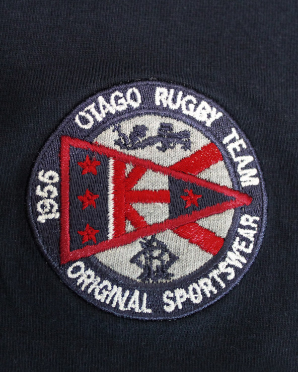 Broderie côté coeur du polo Cross Otago marine pour homme