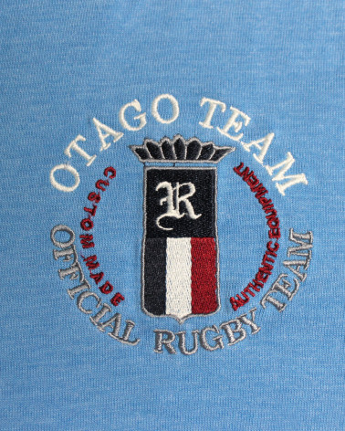 Broderie côté coeur du polo Serioustag Otago bleu ciel chiné pour homme