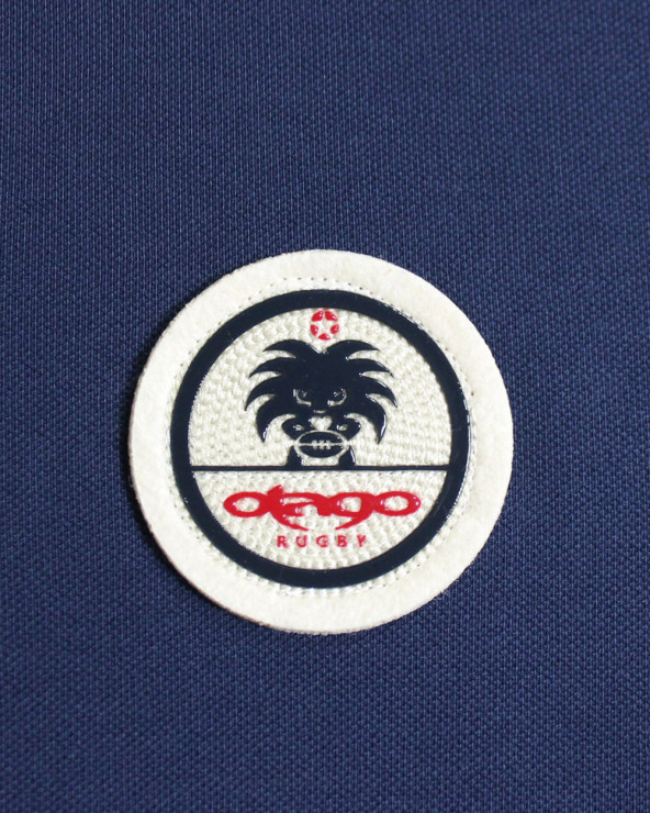 Ecusson cousu côté coeur du polo Swansea Otago bleu marine pour homme
