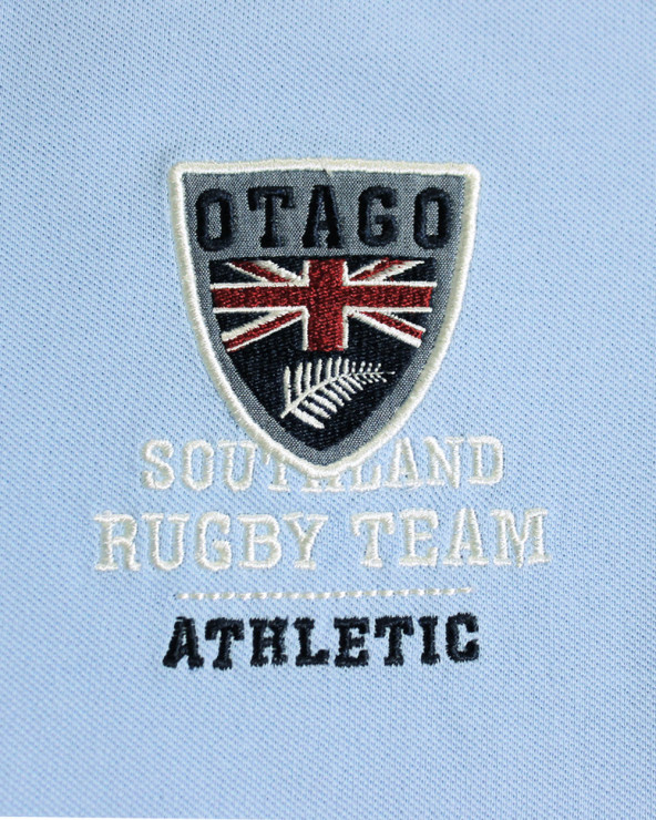 Broderie côté coeur du polo Artax Otago bleu ciel pour homme