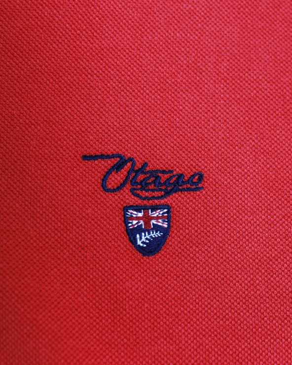 Broderie côté coeur du polo Abruzzo Otago rouge pour homme