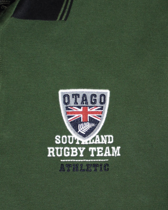 Broderie côté coeur du polo Artax Otago Vert vintage pour homme