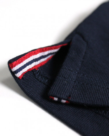 Patte avec liseré aux ouvertures latérales du polo Eckflor pour homme