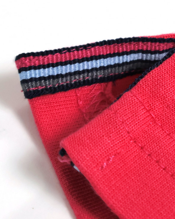 patte d'ouvertures latérales du Polo manches courtes Patreq Otago rugby corail pour homme