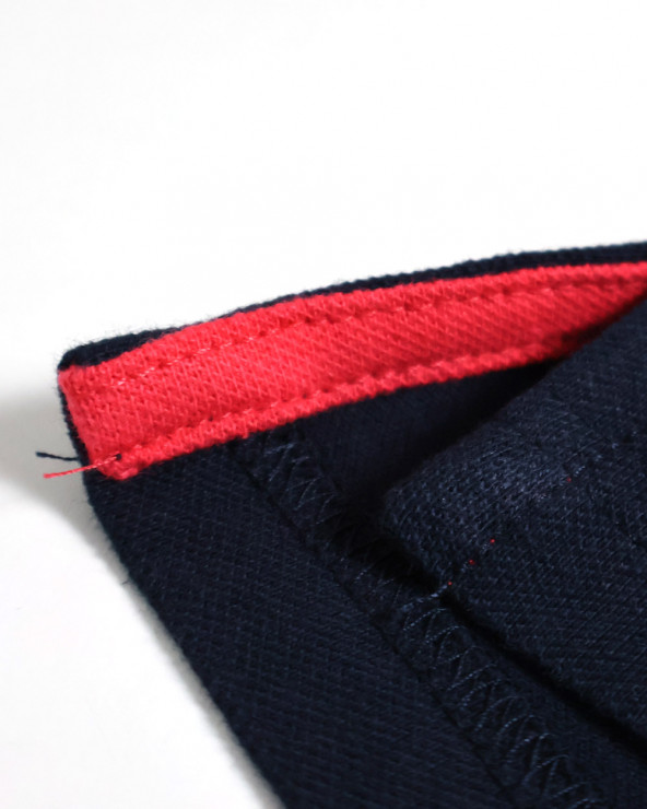 patte d'ouvertures latérales du Polo manches courtes Lorenzo Otago rugby marine pour homme