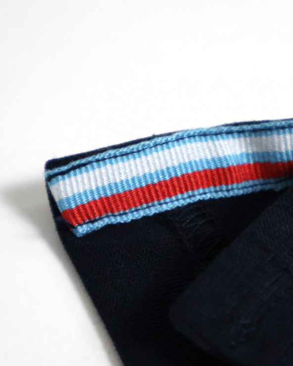 patte d'ouverture latérale du Polo manches courtes Crosslion Otago rugby bleu marine pour homme