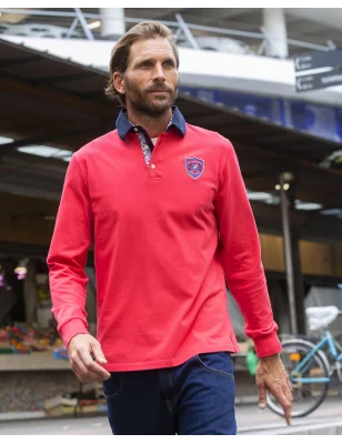 le modèle porte un Polo manches longues corail pour homme Pacitort Otago rugby de face